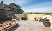 Fell End - two dining tables with bench seating are provided to enjoy barbeque meals
