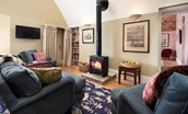 Lakeside Cottage - Alice - the statement log burner is mounted on an reclaimed piece of stone