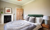 Cairnbank House - bedroom three with decorative fireplace and views over the rear garden