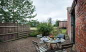 Mullins House - outdoor dining with views across the fields at the rear of the property