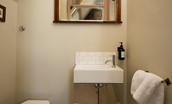 Lindisfarne View - bedroom one en suite toilet with basin and WC