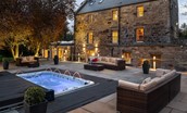 The Old Millhouse - the outside seating area overlooking the swim spa