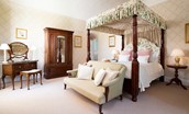 The Tower, Keith Marischal - bedroom one with king size four-poster bed, sofa for two and antique dressing table