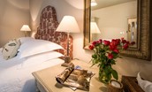 Park End - bedroom with crisp white linen and dressing table