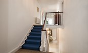 Honeystone House - principal stairway from inner hall to second landing with deep blue stair runner