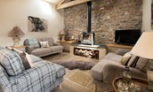 The Old Byre at West Moneylaws - the spacious lounge area featuring contemporary artwork