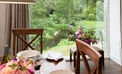 Brunton Burn - dining table with view of the burn