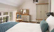 West Mill Cottage - bedroom one has ample storage within the chest of drawers and wardrobe