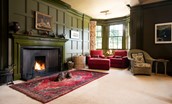 Fairnilee House - open log fire in the cinema room and additional seating area