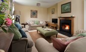 Pirnie Cottage - the sitting room with large sofas and open fire