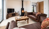 The Elm - unwind in the cosy seating area infront of the tv and wood burning stove