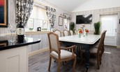 Dryburgh Farmhouse - dining area with seating for 12 guests and wall mounted tv