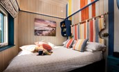 The Beach Hut - ground floor bedroom with double bed and some clever storage