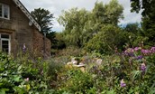 Rowchester West Lodge - the garden is entirely organic and a riot of colour during the summer months