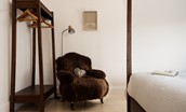 The Hemmel - master bedroom with hanging space and armchair