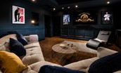 Brockmill Farmhouse - cinema room with large curved sofa and lounger chair