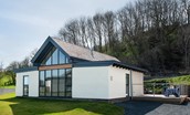Wild Chive Lodge - external view of the stylish lodge which has a fresh contemporary feel with its glazed fronted gable