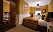 The Hermitage - the master is the more spacious of the two bedrooms, furnished with a king size bed