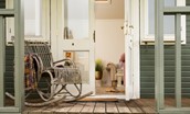 Seaview House - summer house porch with rustic rocking seat