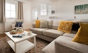 Peep-O-Sea Cottage - large corner sofa and coffee table in living area