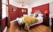 The Clock Tower at Bamburgh Castle - bedroom one with king size bed and rich colour scheme