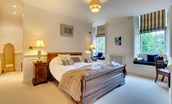 Eslington East Wing - bedroom two with double bed and window seats