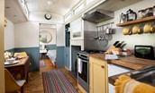 The Showman's Wagon - bedroom and separate snug/bedroom are located at either end of the kitchen and dining area