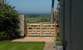 Lookout Cottage - entrance gate and view towards Lindisfarne and the coast