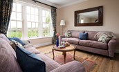 Fairnington East Wing - large triple window in the sitting room with views across rolling countryside