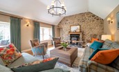 Blackhouse Forest Estate - cosy sitting room with log burner and comfortable seating
