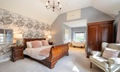 Blackhouse Forest Estate - master bedroom with handcarved super king sleigh bed and free standing bath