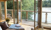 The Boat House - sitting room with doors to balcony