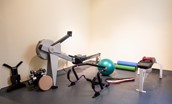 Fairnilee House - gym with rowing machine, weights and yoga mats