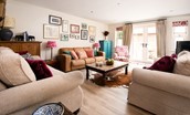 Partridge Lodge - lounge area with large television and games available with direct access to the terrace