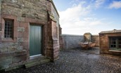The Clock Tower at Bamburgh Tower - private courtyard with seating area