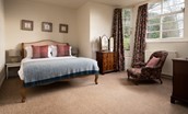 Cairnbank House - garden apartment bedroom one king size bed with occasional chair and two chest of drawers