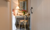 Park End - dressing table in the bedroom and large wall-mounted mirror