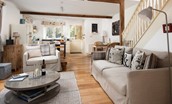 The Old Paper Mill - open-plan living area with exposed beams