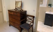 Wark Farmhouse - chest of drawers and access to en suite from bedroom five
