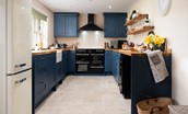 Goose Cottage - well-equipped kitchen with deep blue, shaker-style cabinetry and range cooker