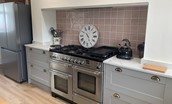 Wark Farmhouse - the kitchen with large cooker