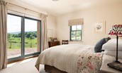 Housedon Haugh - bedroom two with sliding doors leading to the garden