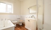 Greay Barns - bathroom one with a walk in shower and separate bath