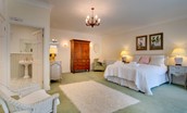The Eslington Lodge - bedroom one with double bed, wardrobe and en-suite