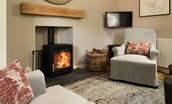 Crailing West Lodge - the cosy wood burning stove in the lounge