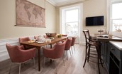 The Linen House - the kitchen is home to a large dining table seating up to twelve guests offering a relaxed yet sophisticated spot for both informal dining and more formal entertaining
