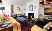 Long Byre - bright sitting room with log burner in the open-plan living space