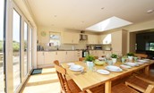 Hawthorn House - bright, spacious kitchen with large dining table and doors out to the patio and garden