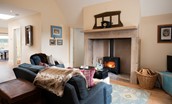 Lakeside Cottage - Emily - cosy log burner with stone fireplace