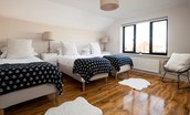 Duneside House - bedroom three with three single beds for flexible sleeping arrangements
